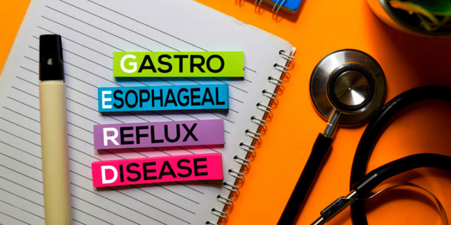 Photo fo a notebook and stethoscope | text: "Gastro Esophageal Reflux Disease" | Wake Clinical